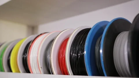 Spools with a plastic thread cable for color printing 3D printer technology Stock Footage 124889996