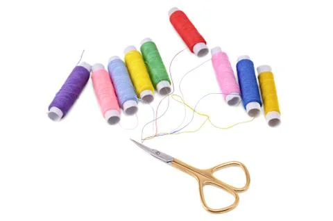 Spools of thread and scissors Stock Photos