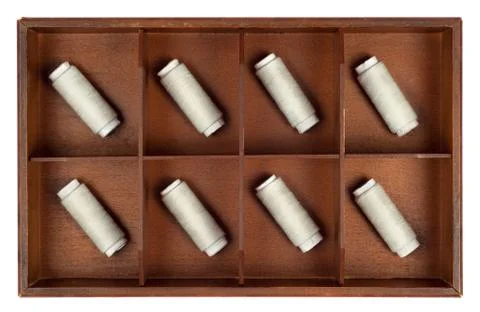 Spools of thread in a box Stock Photos