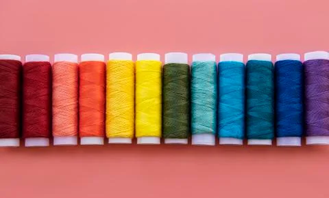 Spools of thread on the colors of the rainbow Stock Photos