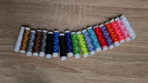 Spools of thread of different colors. Video stock 152410721
