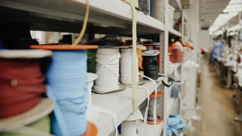 Spools of thread in a garment factory Stock Photos