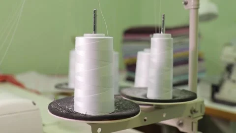 Spools of thread on a loom in a textile factory Video stock 168643953
