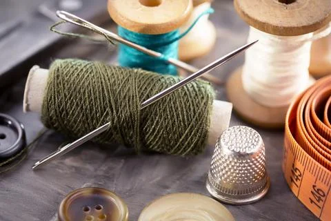 Spools of thread, needles Stock Photos