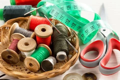 Spools of thread, needles Stock Photos