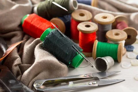 Spools of thread, needles Stock Photos