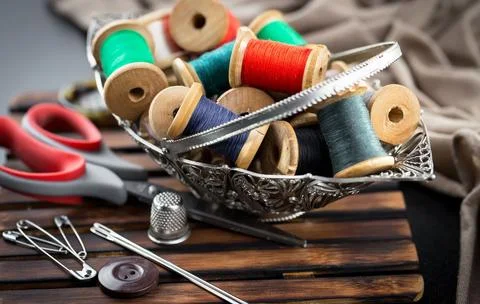 Spools of thread, needles Stock Photos