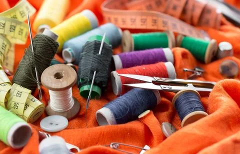 Spools of thread, needles Stock Photos