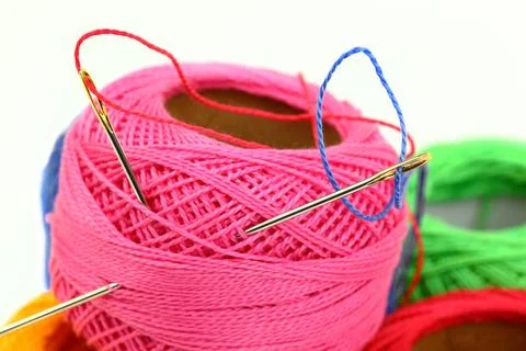 Spools of thread, needles Stock Photos