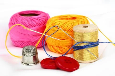 Spools of thread, needles Stock Photos