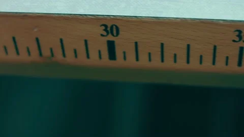 Spools of thread for sewing shoes in dark colors stand on a shelf Stock Footage 232616172