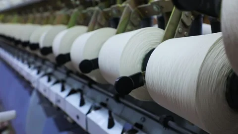 Spools of thread spinning on the machine Stock Footage 165041617