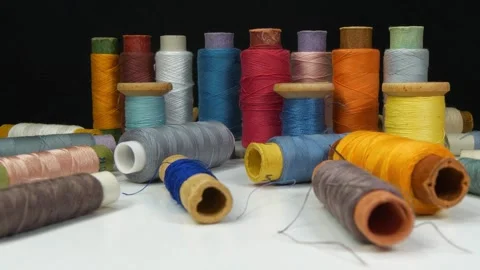 Spools of thread, tilt view video Stock Footage 324682157