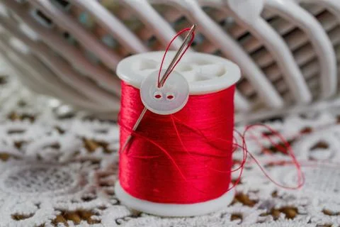 Spools of thread on a wooden background Stock Photos