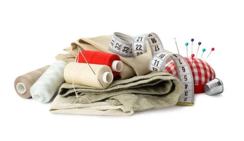 Spools of threads and sewing tools on white background Stock Photos