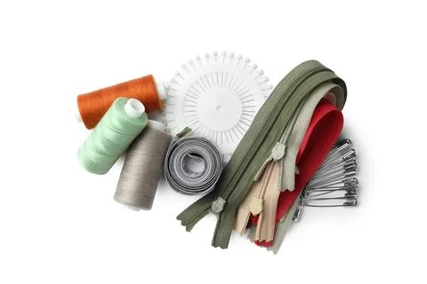 Spools of threads and sewing tools on white background, top view Stock Photos