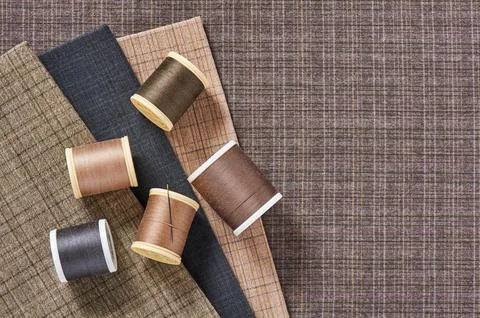 Spools of threads on checkered cotton fabric for quilting and applique Foto stock