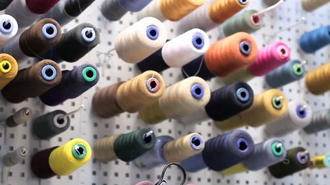 Spools of threads in the studio Stock Footage 72402883