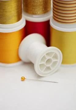 Spools of tread with needle Stock Photos