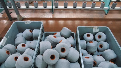 Spools of yarn thread in a basket. Yarn making processes. Threads production Stock Footage 246915493
