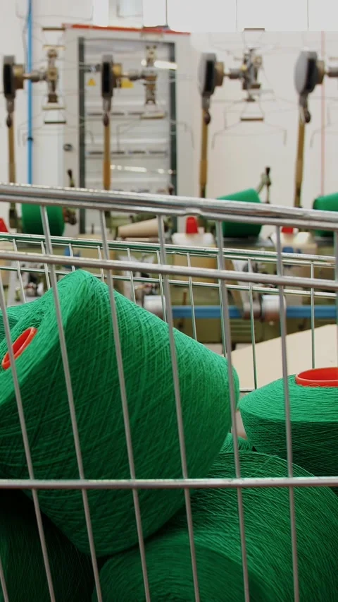 Spools of yarn thread in a basket. Yarn making processes. Threads production. Stock Footage 318808580