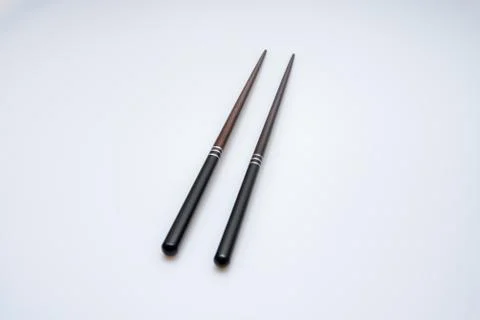 Spoon and chopsticks concept Stock Photos