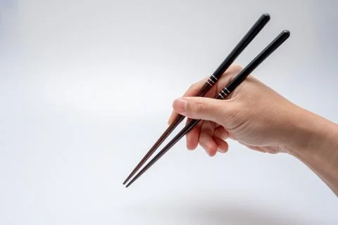 Spoon and chopsticks concept Stock Photos