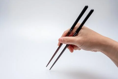Spoon and chopsticks concept Stock Photos