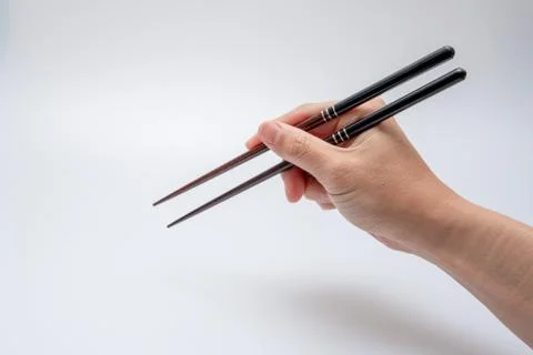 Spoon and chopsticks concept Stock Photos
