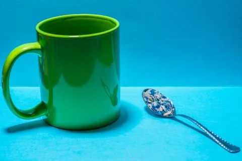 Spoon and cup with microplastics Stock Photos