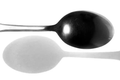 Spoon and Its Shadow Stock Photos