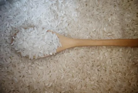 Spoon and rice Stock Photos