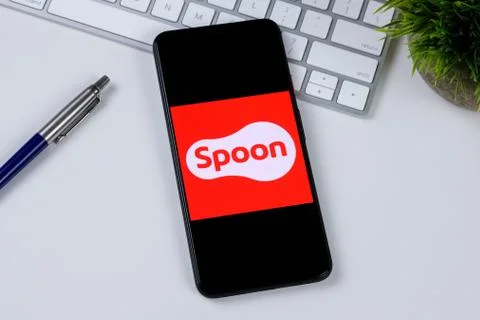 Spoon app logo on a smartphone screen Stock Photos