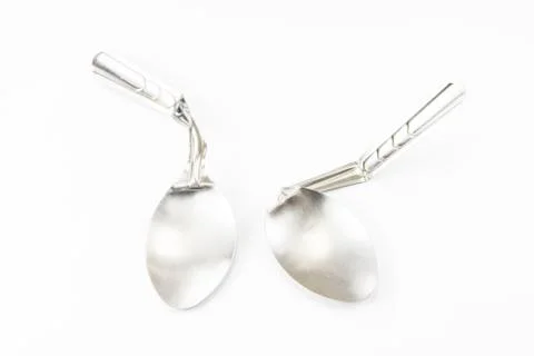 Spoon bending on white background Stock Photos