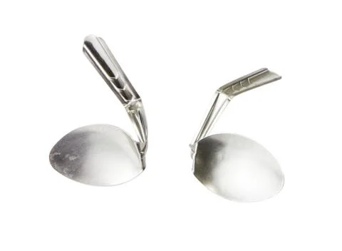 Spoon bending on white background Stock Photos