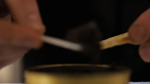 Spoon with black caviar in man hand. Luxurious delicacy. The cook makes Stock Footage 127601619