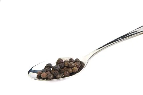 Spoon with black pepper Stock Photos
