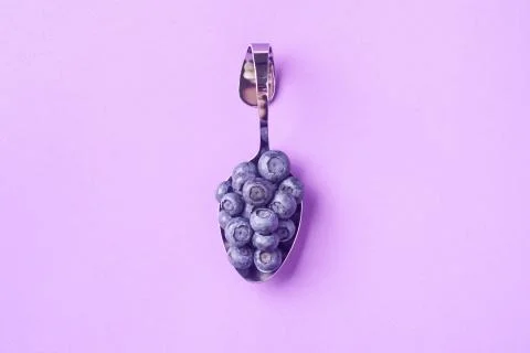 Spoon with blueberries Stock Photos