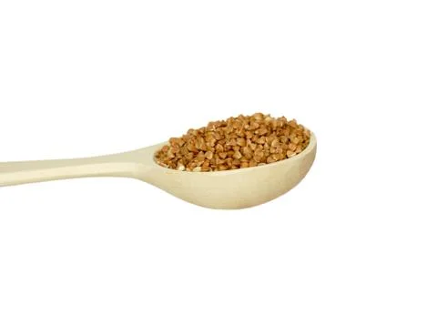 Spoon with buckwheat Stock Photos