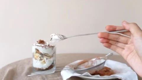 A spoon of chocolate cake with a white background Stock Footage 145674546