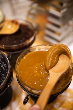 A spoon with chocolate paste on the table Stock Photos