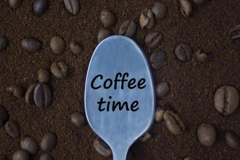 A spoon on coffee beans. Time for coffee. T Stock Photos