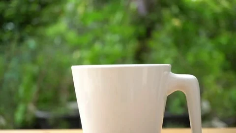 The spoon with coffee put in cup Stock Footage 69158614