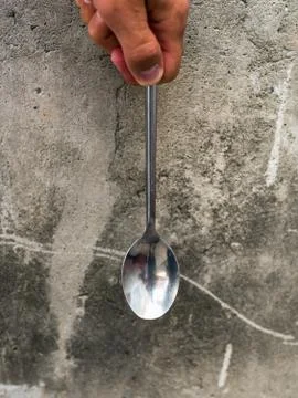 Spoon on concrete background Stock Photos
