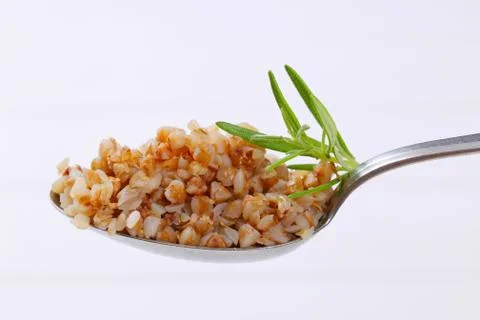 Spoon of cooked buckwheat Stock Photos