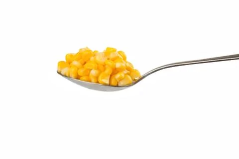Spoon with corn Stock Photos