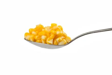 Spoon with corn Stock Photos