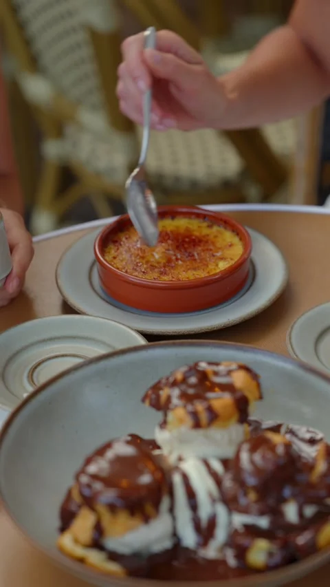 Spoon Cracking Caramelized Crust On Creme Brulee Dessert Stock Footage 341785620