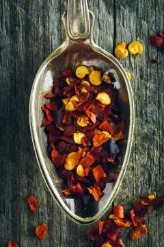 Spoon of crushed red chilli pepper on a wooden background Stock Photos