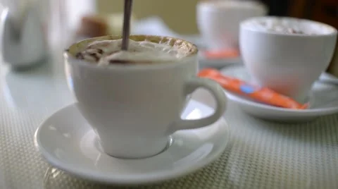 The spoon at the cup of coffee cappuccino Stock Footage 56500433